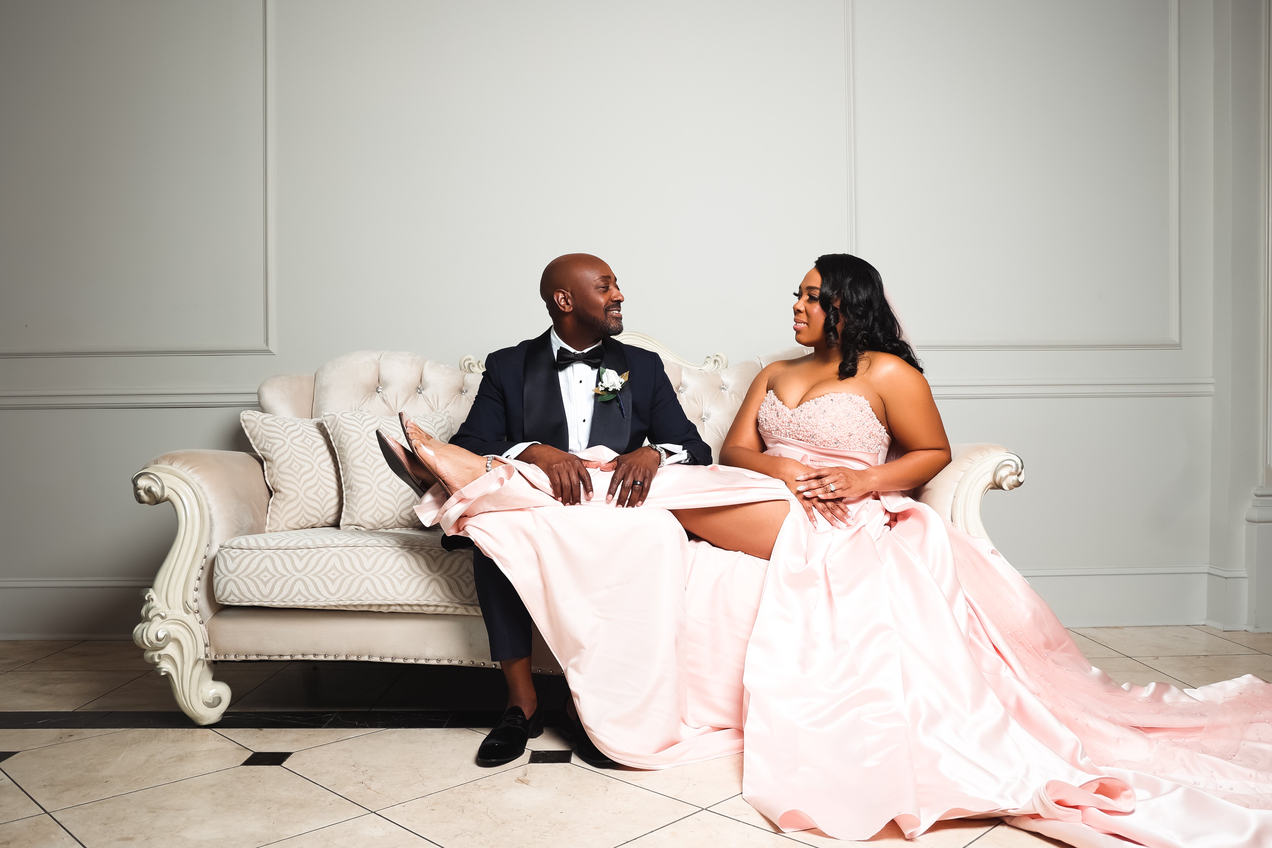 Larry and Jasmine Hill seated together following their ten-year vow renewal